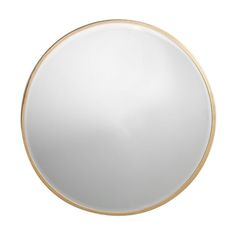 a white and gold circular mirror on a wall