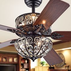 a ceiling fan that is hanging from the ceiling