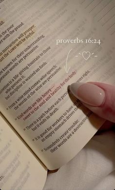 a hand holding an open book with the words provers 1014 written on it