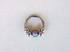 "Silver Septum Clicker or Daith Earring Ring with Purple Opal Stone 📯 SPECIAL OFFER: If you order this Purple Opal septum ring, together with either Blue or White, you will get 3rd one as a gift! 🎁 Blue: https://www.etsy.com/listing/793235153/silver-septum-clicker-daith-earring-ring White: https://www.etsy.com/listing/778769232/silver-septum-clicker-daith-earring-ring HOW YOU CAN WEAR IT? ❖ daith captive bead ring ❖ septum captive bead ring ❖ septum horseshoe ❖ septum retainer DIMENSIONS ❖ 16 Nickel-free Metal Body Jewelry, Round Pierced Fusion Jewelry, Nickel-free Metal Piercings, Nickel-free Round Fusion Jewelry, Fusion Style Nickel-free Round Jewelry, Nickel Free Metal Septum Ring As Gift, Unique Pierced Septum Ring As Gift, Nickel-free Metal Septum Ring As Gift, Unique Nickel-free Septum Ring As Gift