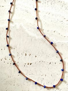 A delicate but strong silk thread with Lapis Lazuli natural gemstone crocheted into it. This necklace is designed for both casual and dress-up style. It is very light and comfortable to wear. Orangesh brown color silk cord Material: Lapis Lazuli Gemstone AAAA Quality (2.5X3.5mm), Silk cord, 14kgf (clasp), Adjustable Brown Hand Knotted Necklaces, Brown Adjustable Hand Knotted Necklace, Bohemian Lapis Lazuli Beaded Necklace With Adjustable Fit, Adjustable Bohemian Lapis Lazuli Beaded Necklace, Silk Cord Necklace, Lapis Lazuli Gemstone, Hippie Necklace, Silk Cord, Thread Crochet