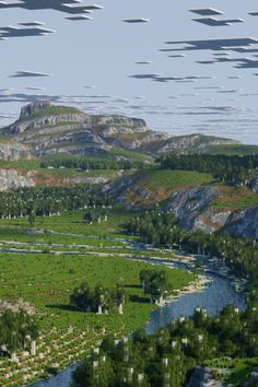 an aerial view of a river and mountains