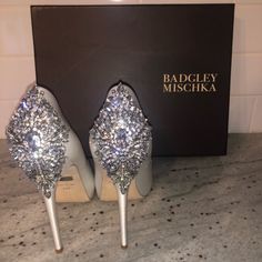 Brand New. Worn Once For A Couple Minutes While Trying On Gown, Perfect Condition. Absolutely Stunning Shoe, Satin Material. Leather Sole, Heel Measures 4.5”. Platform Measures 1 Inch, Peep Toe Platform Pump Featuring Dramatic Cluster Of Sparkling Rhinestones At Heel. Comes With Box And Bag It Was Purchased In. Sparkly Fashion, Badgley Mischka Shoes, Stunning Shoes, Satin Material, Platform Pumps, Badgley Mischka, Champagne Flute, Elegant Fashion, 1 Inch