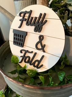 a sign that says fully and fold on top of a potted plant in the kitchen