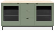 a green cabinet with two glass doors and one door open to reveal the bottom shelf