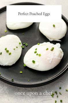 three poached eggs on a black plate with green chives and text that reads, perfect poached eggs once upon a chef