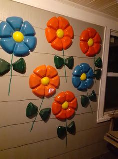 colorful flower decorations on the side of a building