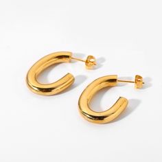 Discover the modern elegance of Oval Hoop Earrings, beautifully crafted in 18k gold plating. These hoops feature a unique oval shape, offering a contemporary twist to the classic hoop style, perfect for any fashion-forward ensemble. Elegant Oval Hoop Earrings, Chic Gold Oval Hoop Earrings, Modern Oval Hoop Earrings, Minimalist Oval Metal Hoop Earrings, Minimalist Gold Plated Oval Hoop Earrings, Gold Brass Oval Hoop Earrings, Thick Hoop Earrings, Oval Hoop Earrings, Gold Hoops