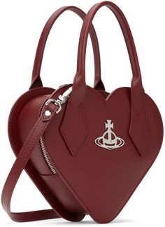 Heart-shaped grained faux-leather top handle bag in red. · Rolled carry handles · Adjustable and detachable crossbody strap · Logo hardware at face · Two-way zip closure · Card slot at interior · Twill lining · H7.5 x W9 x D2.75 Supplier color: Red Heart Crossbody Bag, Vivienne Westwood Bags, Vivienne Westwood Red, Fashion Moodboard, Faux Leather Top, The Vivienne, Mood Board Fashion, Handle Bag, Vivienne Westwood