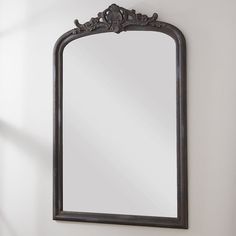 an ornate mirror hanging on the wall