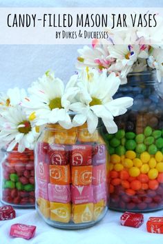 candy filled mason jar vases with flowers and candies