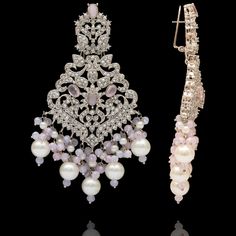 Remarkable heritage jewelry that portrays immaculate precision and technique! Exquisitely crafted earrings with pink and CZ stones along with pink moti and pearl adornments. Approximate earrings length is 4". Silver-plated on high-quality brass as base metal. Made by order. Kindly allow 5-7 weeks for the delivery of this item. For custom or urgent requests, please contact support@alacouture.com. *Please Note: We use faux stones and beads in all of our jewelry. Elegant Pink Earrings With Stone Work, Elegant Pink Bridal Earrings With Stone Work, Elegant Pink Stone Work Danglers, Elegant Pink Danglers With Stone Work, Elegant Pearl Bridal Earrings With Stone Work, Elegant Bridal Earrings With Stone Work And Pearl, Pink Stone Work Earrings For Wedding, Elegant Pink Chandbali Pearl Earrings, Pink Earrings With Stone Work For Wedding