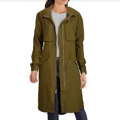 Kenneth Cole Women's Crinkle Hooded Anorak Coat Price Drop - Just Reduced This Below The Knee Anorak Is Sure To Please, It Is Dressed In A Cool Crinkle Nylon Fabric With A High-Low Hem And Attached Hood. Details: -Size: Xs -Color: Olive -Attached Hood, Zig Zag Details -Crinkle Fabric -Exposed Center Front Zip -Hidden Inner Draw Cord -High Low Hem With Back Stopper -Imported -Lined -Stand Collar With Attached Hood -Machine Washable -Nylon - N;Lt #050 Thanks For Dropping By Our Closet And Supporti Casual Parka With Drawstring Hood For Travel, Casual Parka With Detachable Hood For Travel, Casual Khaki Windbreaker For Travel, Casual Outerwear With Drawstring Hood For Travel, Casual Travel Parka With Detachable Hood, Fall Khaki Nylon Utility Jacket, Casual Parka With Double-lined Hood For Travel, Casual Spring Parka For Travel, Casual Travel Parka With Double-lined Hood