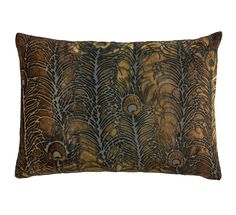 a brown and black pillow with feathers on it