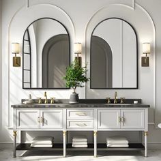 a bathroom with two sinks and mirrors on the wall next to each other in front of an arched window