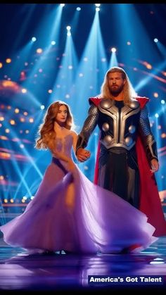 a man and woman dressed up as thor and lady in front of bright stage lights