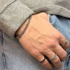 A chunky, classy, and timeless 5mm curb stainless steel chain bracelet that will not tarnish or rust over time, even when worn in the water. 💎Free shipping on all orders💎Waterproof and non-tarnish💎Packaging that is ready to offer as a gift💎Customizable and adjustable chain length A durable, waterproof, and non-tarnish silver chain bracelet This stainless steel handmade chain bracelet is not only waterproof but also resistant to tarnishing and will maintain its shine over the years. You can w Minimalist Cuban Link Bracelet With Stainless Steel Clasp, Trendy Stainless Steel Cuban Link Bracelet As Gift, Classic Cuban Link Silver Bracelet, Modern Stainless Steel Cuban Link Bracelet For Everyday, Everyday Cuban Link Bracelet With Stainless Steel Clasp, Classic Metal Cuban Link Bracelet With Curb Chain, Everyday Cuban Link Bracelet With Curb Chain, Classic Cuban Link Bracelet With Stainless Steel Clasp, Stainless Steel Cuban Link Chain Bracelet With Adjustable Chain