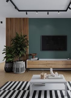 a living room with green walls and black and white striped rugs on the floor