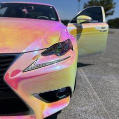 two different colored cars parked next to each other