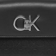 Brand: Calvin Klein Gender: Women Type: Bags Season: Spring/Summer PRODUCT DETAIL • Color: black • Pattern: plain • Fastening: with clip • Size (cm): 12x18x4 • Details: -handbag -with shoulder strap COMPOSITION AND MATERIAL • Composition: -78% polyester -22% polyurethane