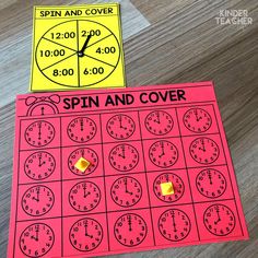 the spin and cover game is shown with two pieces of paper on top of it