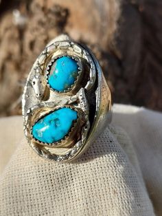 Silver Snake Turquoise Ring - Native American Made Jewelry - Mans Ring - Turquoise Ring - Hand Crafted Mans Ring This size 13 turquoise ring is created uniquely, with two turquoise nuggets casted with a snake wrapped around them in a figure eight.  Not another one like it.  Pure silver ring with two turquoise nuggets casted and circled with a silver snake.  Meaning eternal love - engagement ring for men. 1970's Native American Jewelry - Southwestern - Nature - Handmade - Handcrafted Measures: Size 13 - 1 1/4" ring height x 7/36" band height Adjustable Turquoise Open Ring For Wedding, Artisan Turquoise Collectible Rings, Southwestern Turquoise Rings With Patina, Turquoise Ring With Patina, Turquoise Ring With Patina For Anniversary, Turquoise Vintage Promise Ring, Anniversary Turquoise Ring With Patina, Adjustable Southwestern Style Ring With Patina, Southwestern Style Ring With Patina