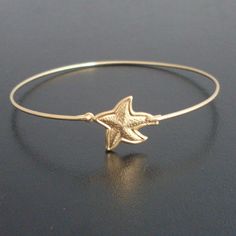 Starfish Bangle Bracelet Gold Starfish Bracelet by FrostedWillow, $15.95 Star-shaped Bracelet With Starfish Charm Gift, Starfish Charm Bracelet As Gift, Gold Ocean-inspired Starfish Bracelets, Adjustable Gold Star Bracelet, Adjustable Gold Star Charm Bracelet, Gold Charm Bracelet With Starfish For Beach, Starfish Charm Bracelet Gift, Ocean-inspired Gold Jewelry With Star Charm, Gold Nautical Jewelry With Star Charm