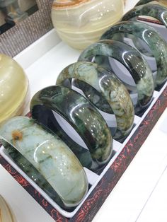 Selected 7 piece collection of domed, wide cut Jade bangle bracelets 🤗! Speckled or veined black-green with water or milky translucency; 0.9 cm thickness, 2.5 cm width and weighs approximately 90 grams a piece. Old pieces from our collection. Bangles in sizes 65 (6.5 cm inner diameter). Listed price is for 1 piece bangle only. Jade Bracelet Bangles, Jade Bangle, Pretty Jewellery, Black Green, Bangle Bracelets, Jade, 1 Piece, Jewelry Bracelets, Thailand