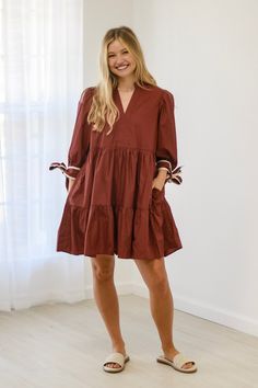 Details Solid 3/4 sleeve v neck tiered mini dress Pockets at side Self-tie bow detail at cuff Material and Care 65% polyester, 35% cotton ❤️ Family owned business operated with love & passion 🧐 All products carefully hand picked & analyzed for great quality ✈️ Lightning fast secure shipping with tracking number included