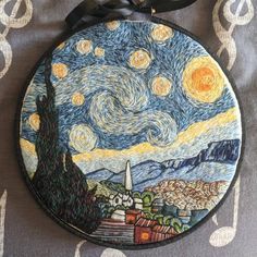 an ornament with a painting on it that looks like the starry night