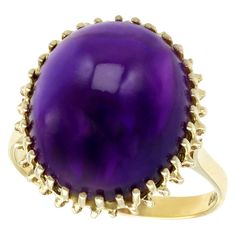 A fine and impressive vintage 12.88 carat amethyst and 14 karat yellow gold cocktail ring; part of our diverse vintage gemstone jewelry and estate jewelry collections. This fine and impressive cabochon cut amethyst ring has been crafted in 14k yellow gold. The pierced decorated, basket style setting displays a feature 12.88Ct cabochon cut amethyst, held within a multi-claw/prong arrangement. The pierced decorated, tapering and elevated ring shoulders integrate with the main setting and blend sea Yellow Gold Dress, Amethyst Ring Vintage, Yellow Gold Cocktail Ring, Basket Style, Vintage Cocktail Ring, Gem Diamonds, Gold Cocktail Ring, Jewels Rings, Gold Cocktail