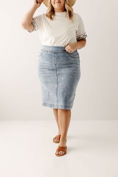 Simple lines, classic and comfortable, the 'Sara' is everything a denim skirt should be! This skirt is made from a soft, stretch denim to ensure a flattering and modest fit and is as comfy as they come! The details include minimal distressing, faux front pockets, and functional back pockets. Featuring a wide waistband for extra comfort and ease of styling. Exclusively designed by us for you. 97% Cotton 3% Spandex Machine Wash Cold Hang to Dry Functional Back Pockets Available in 21", 24", and 26 Knee Length Denim Skirt, French Capsule Wardrobe, Denim Skirts Knee Length, Clothing Wishlist, Corduroy Overall Dress, Denim Skirt Outfits, Modest Fits, Mama Style, Overall Dress