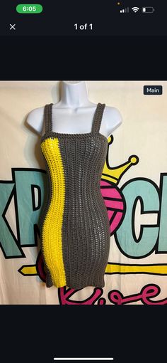 a dress made out of knitted material with yellow and grey stripes on the side