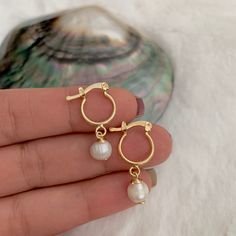 Elevate your everyday style with these delicate Pearl hoop earrings.  Delicate small pearl hoop earrings. These freshwater pearl hoop earrings are a good option for your bridesmaid thank you gift.  ♥ ITEM DETAILS: Earring Dimensions: Total Length: 25 mm Total Diameter: 11 mm Materials: 18K Gold Plated Hoops - Freshwater Pearl.  Color available: Gold. Pearl color available: White. ♥ GIFT IT Jewelry comes in a cute organza bag ready to gift! If you wish your item to be a gift, please let me know a 14k Gold-filled Huggie Hoop Earrings With Pearl Charm, Elegant Tiny 14k Gold-filled Huggie Earrings, Delicate Small Hoop Huggie Earrings, Dainty Huggie Pearl Earrings With Charm, Dainty Small Hoop Huggie Earrings With Pearl Charm, Dainty Huggie Earrings For Wedding, Delicate Huggie Hoop Earrings With Pearl Charm, Minimalist Gold Plated Huggie Pearl Earrings, Elegant Tiny Huggie Hoop Earrings