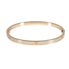 Cartier Love Bracelet, Small Model, Paved (Yellow Gold)  PRIMARY DETAILS  SKU: 141107  Listing Title: Cartier Love Bracelet, Small Model, Paved (Yellow Gold)  Condition Description: Cartier's Love collection is the epitome of iconic, from the recognizable designs to the history behind the line-up. The collection started in 1969 with the bangle bracelet, which is engraved with a circular motif throughout to mimic the look of the bracelet's signature screw-lock mechanism.     In excellent condition and recently polished. Comes with the original box and papers.  Brand: Cartier  Collection/Series: Love  Metal Type: Yellow Gold  Metal Purity: 18k  Chain or Bracelet Length (in): 17  Pre-Owned Jewelry Condition: Excellent  SIDE STONE INFORMATION  Side Stone Weight 1 (cts): 0.95  Side Stone 1 Shap Elegant Cartier Diamond Jubilee Bracelet, Cartier Diamond Bracelet For Wedding, Elegant Cartier Bracelets With Diamond Accents, Cartier Fine Jewelry Bracelet With Diamond Accents, Elegant Cartier Diamond Bracelet For Wedding, Cartier Bangle With Single Cut Diamonds, Elegant Cartier Diamond Bracelet, Elegant Cartier Diamond Bangle, Cartier Diamond Bangle Bracelet