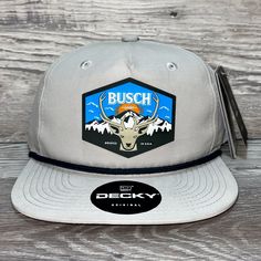 Our Pvc Patch Is A Waterproof, Rugged, And Clean Looking Design. You Can Bet That This Patch Will Look Vibrant For Years To Come. We Only Use The Highest Quality Products And Headwear. We Believe That Our Pvc Patches Beat Out Any Other Type Of Patch Offered On A Hat. Design: Busch Light Mountain Escape Hat: Decky Color: Grey/ Charcoal Soft-Structured, Five-Panel, High-Profile 70/30 Cotton/Nylon Adjustable Plastic Snapback Slight Curve, Is Adjustable Either Way Hat Size: 7 - 7 3/4 Nike Outdoor Hats, Nike Outdoor Hats With Curved Brim, Nike Adjustable Hats For Outdoor, Nike Adjustable Outdoor Hats, Nike Visor, Tactical Hat, Rare Nikes, Nike Hat, Pvc Patches