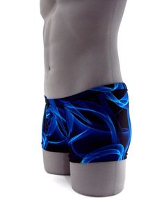 "Designed with a vibrant look sure to turn heads,this men's swimsuit lights up the beach or pool in refreshing style,this eye-catching stretch nylon square cut swimsuit for men stands out for all the right reasons. MADE IN USA PLEASE NOTE: All print fabric designs swimsuits varies, no two are alike. Drawcord waist 7\" Inch Side seams 3/4 inch waist elastic 3/8 inch leg elastic Center seam front pouch" Blue Swimwear With Built-in Shorts For Swimming, Blue Fitted Boxer Briefs For Summer, Fitted Blue Boxer Briefs For Summer, Summer Fitted Blue Boxer Briefs, Fitted Blue Boxer Briefs With Built-in Shorts, Blue Stretch Boxer Briefs For Beach Season, Blue Short Swimwear For Swimming, Fitted Boxer Briefs For Surfing And Beach Season, Blue Swim Trunks For Diving In Summer