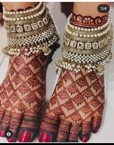 the feet are decorated with beads and chains