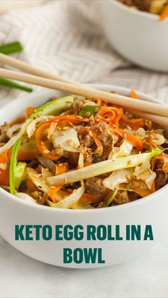 an egg roll in a bowl with chopsticks next to it and the words, keto egg roll in a bowl