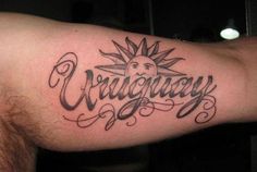 a man with a tattoo on his arm that says crazyway in cursive writing