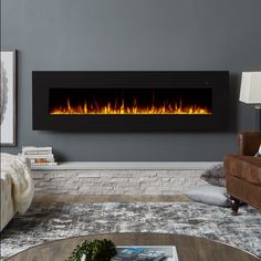 a living room with a couch, chair and fire place in the wall above it