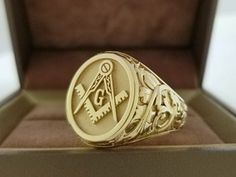 This is a highly detailed masonic ring with leaf design. 1.Material - solid 14k gold. This can also be made with 10kt or 18kt gold. Please inquire for price. 2.Stone - none but this can also be made with one diamond or gemstone set on top of the compass for additional cost. 3.Dimensions - top of ring is approximately 17x15 mm Ring is made solid with solid smooth inside back. Current processing time to make and finish this ring is about 3 weeks You can see some more examples of my finished jobs o Masonic Rings Jewelry, Wax Seal Ring, Freemason Ring, Masonic Jewelry, Masonic Ring, The Compass, Magical Jewelry, Silver Spinner Rings, 18k Gold Ring