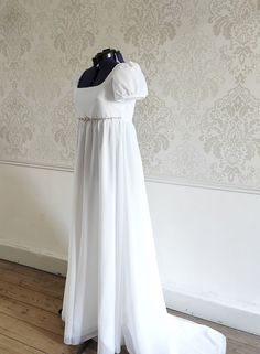 White Floor-length Dress For Debutante Ball, White Fitted Chiffon Dress, White Dress With Fitted Bodice And Empire Waist, White Summer Dresses For Debutante Ball, White Empire Waist Dress With Fitted Bodice, White Ruched Bodice Dress For Debutante Ball, Fitted White Maxi Dress With Lined Bodice, White Fitted Chiffon Dress For Formal Events, White Fitted Chiffon Dress For Formal Occasions