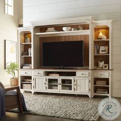 a living room with a large entertainment center