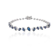 This is part of Chairish’s Fine Jewelry assortment.  This Modern Natural Blue Sapphire Bracelet in 18K gold showcases endlessly sparkling natural blue sapphire of 3.95 carats. It measures 7 inches long in length.  Sapphire stimulates concentration and reduces stress.  Designed with perfect mixed cut blue sapphire set in solid gold to make you stand out on any occasion or event. The elegant style complements the attire beautifully and is a perfect Engagement Gift, Bridal Shower Gift, Valentine Gi Sapphire Bracelets For Formal Occasions, Timeless Blue Bracelet For Formal Occasions, Elegant Tanzanite Bracelets For Formal Occasions, Formal Blue Diamond Bracelet Hand Set, Formal Sapphire Bracelets In Fine Jewelry Style, Formal Sapphire Tennis Bracelet In Fine Jewelry Style, Elegant Blue Tennis Bracelet For Formal Occasions, Anniversary Sapphire Tennis Bracelet, Elegant Sapphire Tennis Bracelet With Jubilee Band