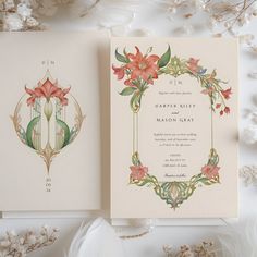 two wedding cards with floral designs on them