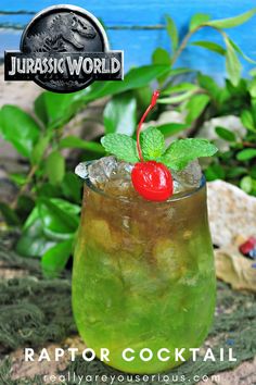 a green drink in a glass with a cherry garnish on the top and text overlay that reads, raptor cocktail