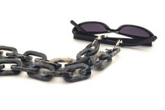 A luxury acetate chain in shades of gray forms this statement glasses necklace for an exclusive appearance. For more ways to wear it, join the closures to get a striking necklace bringing every style to the next level. Nothing less than a stunning accessory! SPECIFICATIONS ‣ European acetate. ‣ Stainless Steel details. ‣ Logo on end. ‣ Grips closure fastening. ‣ Width: 40mm. ‣ Lenght: 70cm (27''). ‣ Includes a pair of black and clear rubber loops. ‣ Packed in a custom eco box. BENEFITS ‣ Premium Chunky Glasses, Tortoiseshell Glasses, Resin Chain, Eyewear Chain, Eyeglass Strap, Tortoise Shell Glasses, Glasses Chains, Sunglasses Holder, Sunglasses Strap