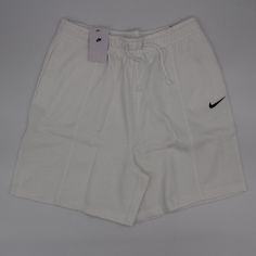 Nike Women's Sportswear Hi Rise Loose Fitwhite Fleece Short Color: White Heavy-Weight Cotton Blend Fleece Cut High Waist Lounge-Ready Fit 2 Side Pockets Machine Washable 80%Cotton, 20%Polyester Elastic And Drawstring Closure Measurement: Us Medium: Waist 32"(Unstretched)/ Rise 14"/Inseam 6.5"/Leg Opening 30"/Outseam 20.5" Measurement: Us Large: Waist 35"(Unstretched)/ Rise 15"/Inseam 6.75"/Leg Opening 30"/Outseam 21.25" Measurement: Us Small: Waist 28"(Unstretched)/ Rise 14"/Inseam 6.25"/Leg Ope Sporty Fleece Sports Shorts, Sporty Fleece Shorts For Sports, White Sporty Shorts For Loungewear, Sporty White Shorts For Loungewear, Nike Solid Activewear For Streetwear, Sportswear Sweats With Drawstring For Sports, Casual Fleece Sports Shorts, White Relaxed Fit Casual Sweats, Casual White Relaxed Fit Sweats