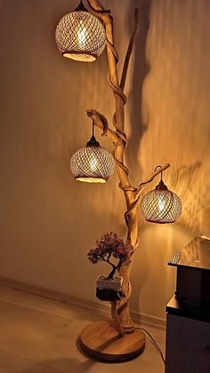 Bring nature-inspired lighting into your space with this unique tree branch floor lamp. The organic shape and warm glow from woven lampshades create a cozy ambiance, perfect for adding rustic charm and artistic lighting to any room. Diy Turkish Lamp, Diy Floral Decor, Wood Light Fixture, Colourful Living Room Decor, Artistic Lighting, Driftwood Lamp, Coffee Room, Boho Crafts Diy